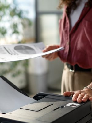 a woman using a printer to scan a document using Tungsten Express