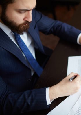 Lawyer signing a contract