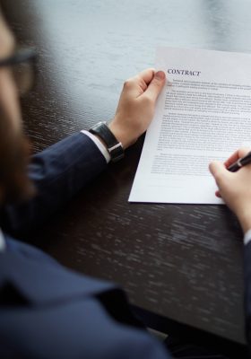 Lawyer signing a contract