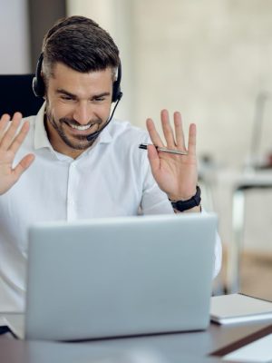 a man wearing a headset having an animated phone call. Routed by operator connect