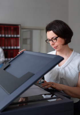 a woman using a printer with Printix