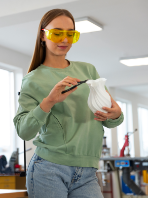 Designer trimming her 3d printed creation