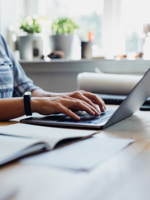 a person typing on a laptop using Connectyx software