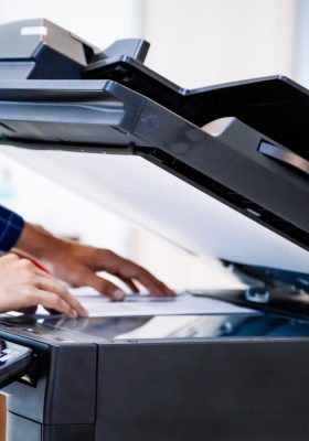 a person using a photocopier