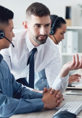 2 men working in a call center