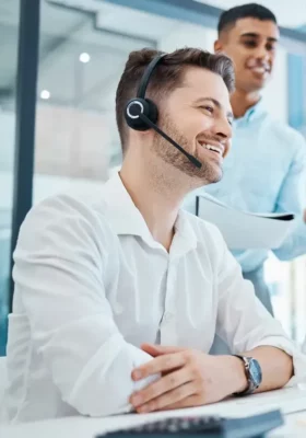 CRM, call center, telemarketing and about us representative team reading on computer for review, feedback or email in a office. using a hardware headset