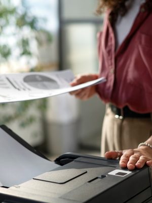 a woman using a printer with Tungsten SafeCom