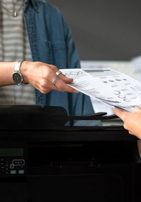 a person handing over a piece of paper to a person