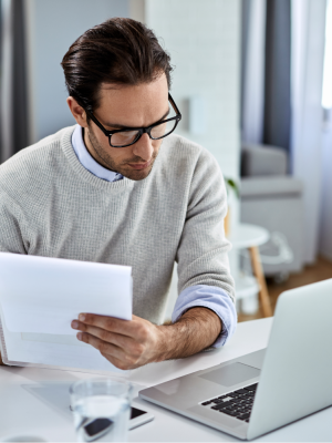 a man looking at an invoice he digitized using Tungsten AP Essentials